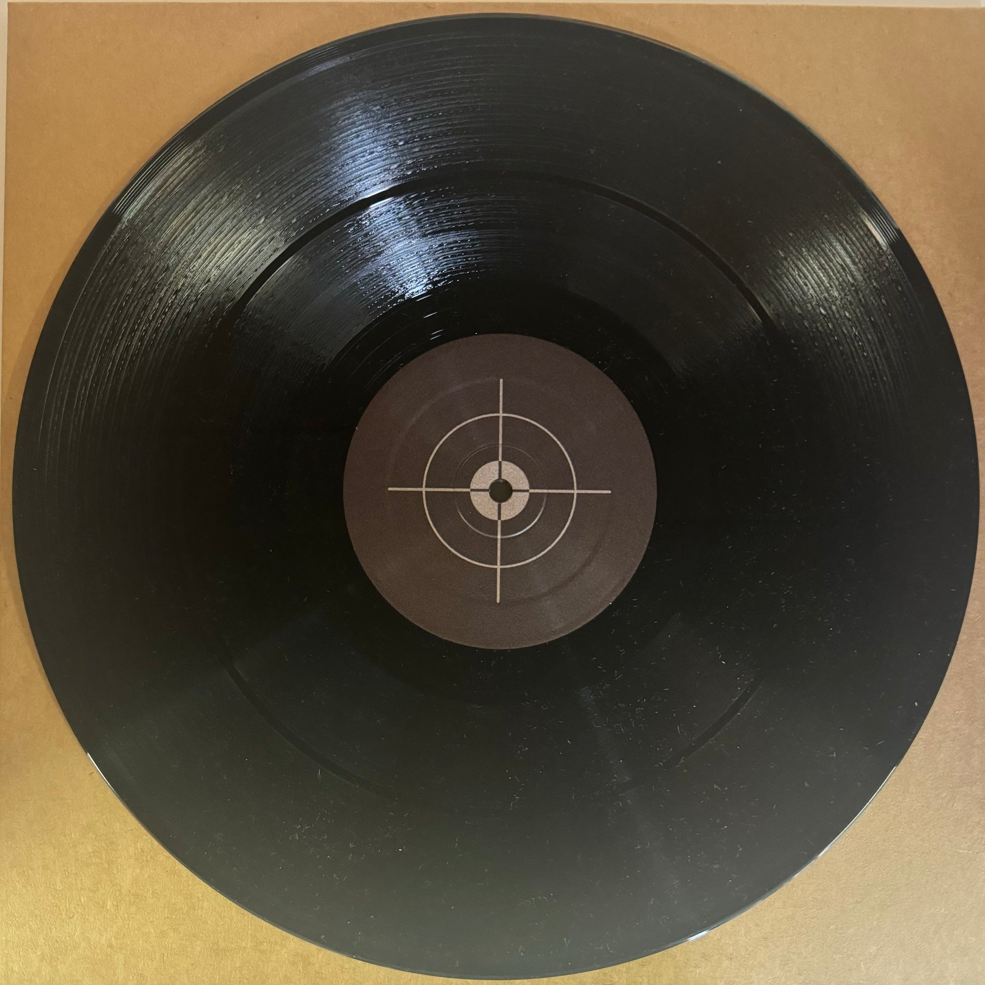 vinyl record with a grey target as artwork