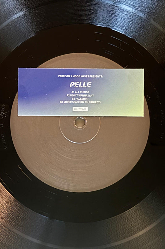 vinyl record with a sticker on it saying Partisan x Mood Waves Pelle