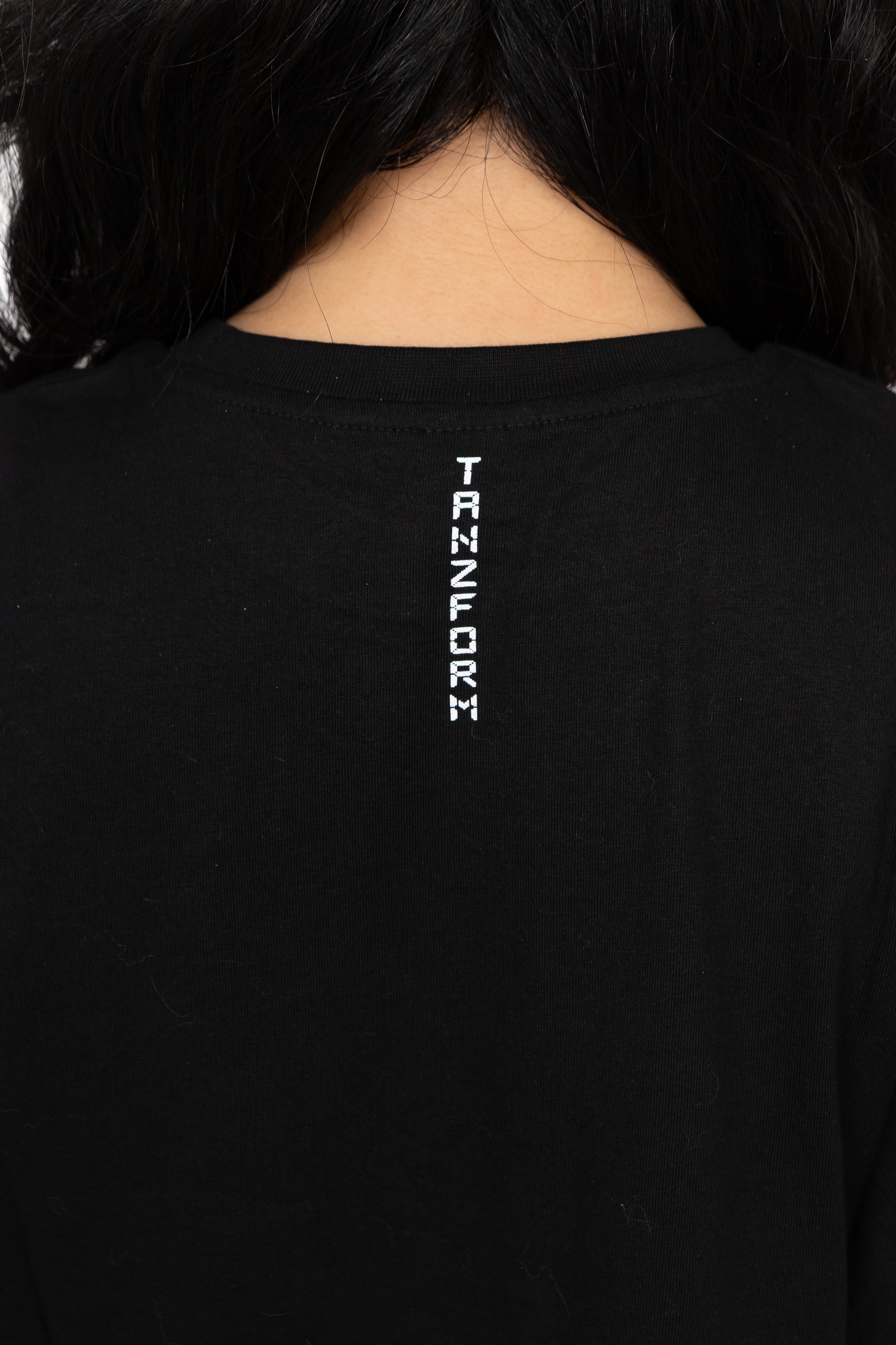 Black t-shirt with 'TANZFORM' logo on the back
