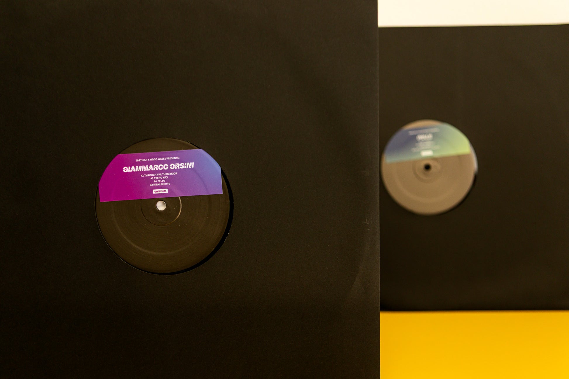 Vinyl record with a colorful label on a black background
