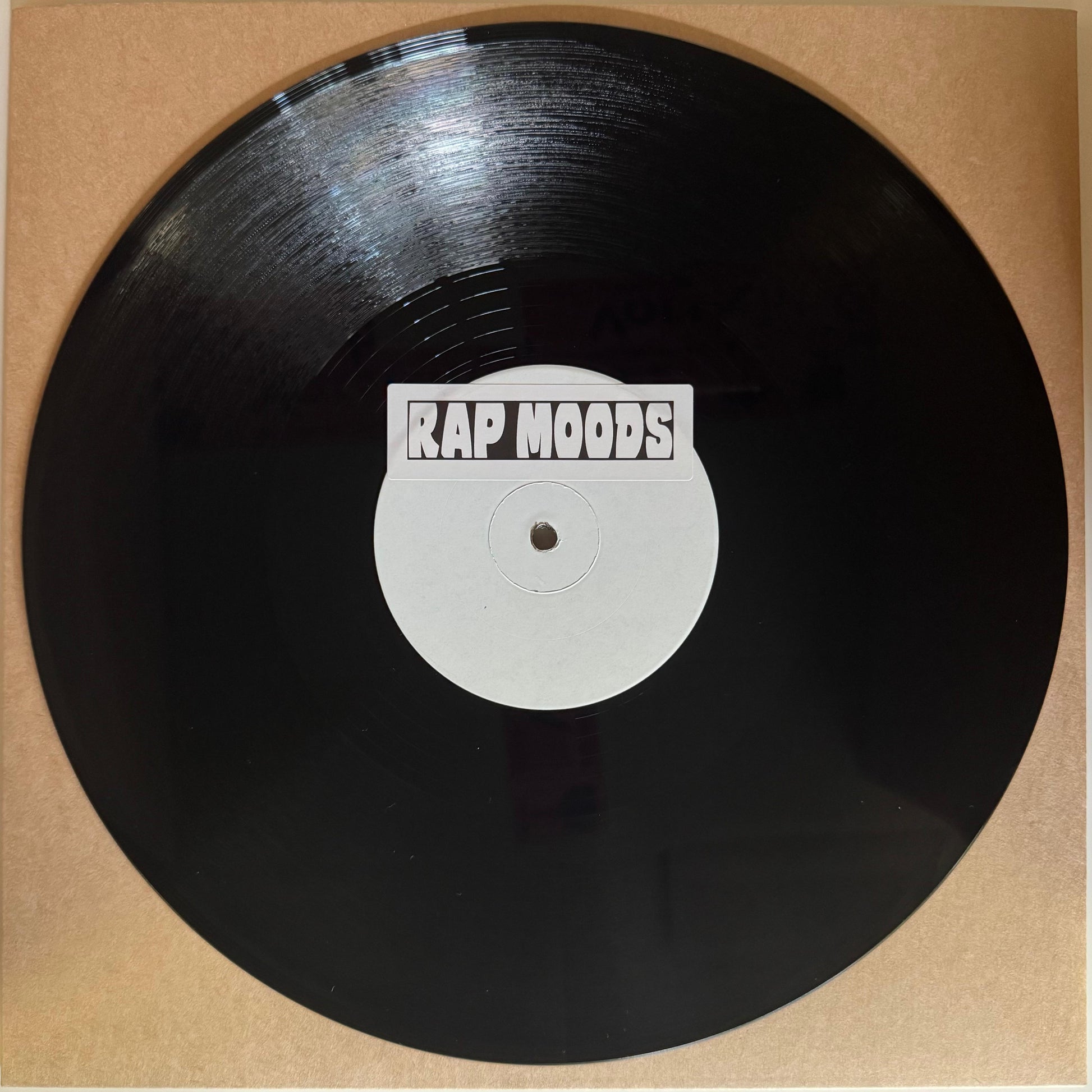 Vinyl record with 'Rap Moods' label inside a cardboard sleeve