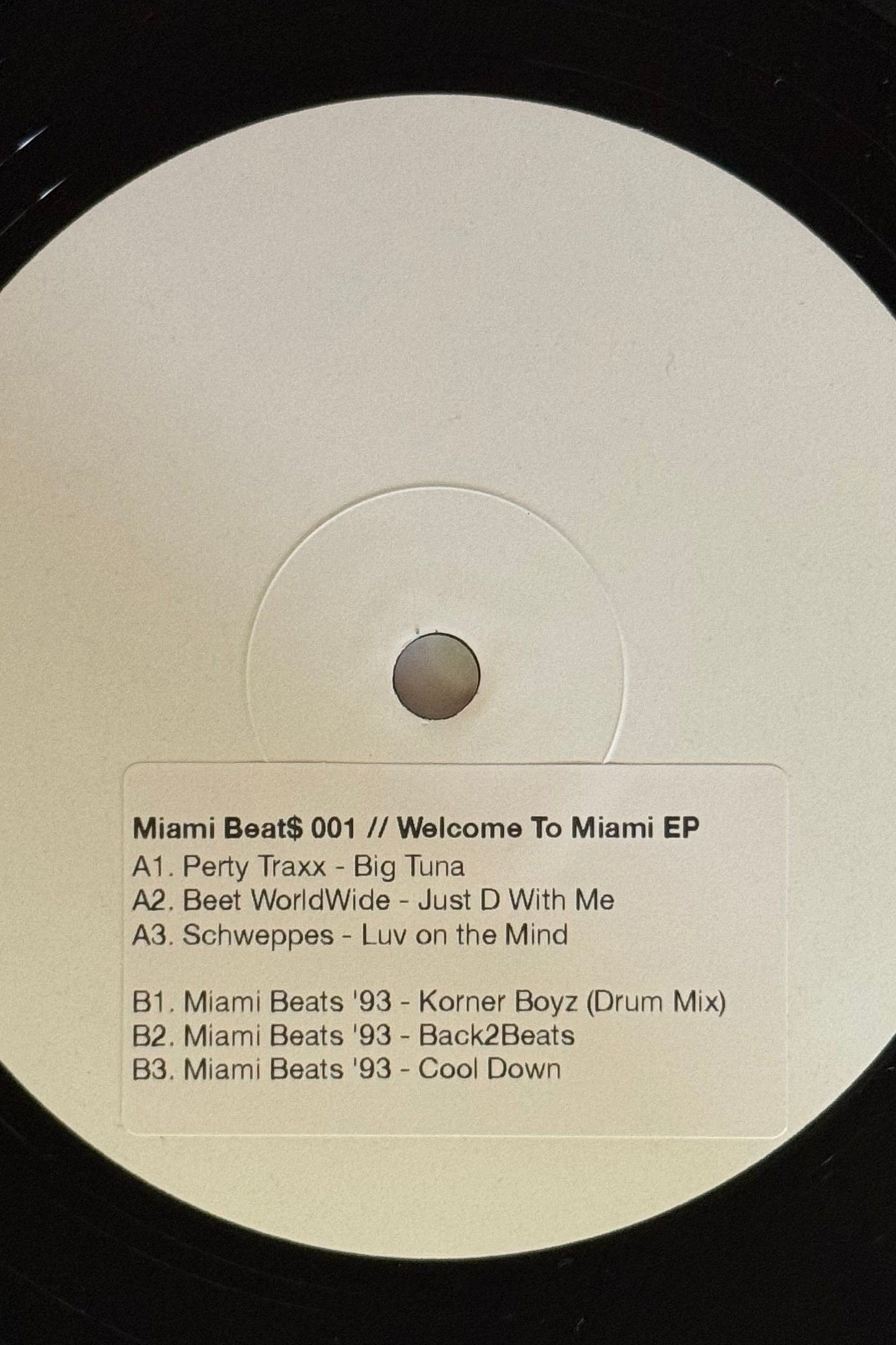 white label vinyl record with track names sticker