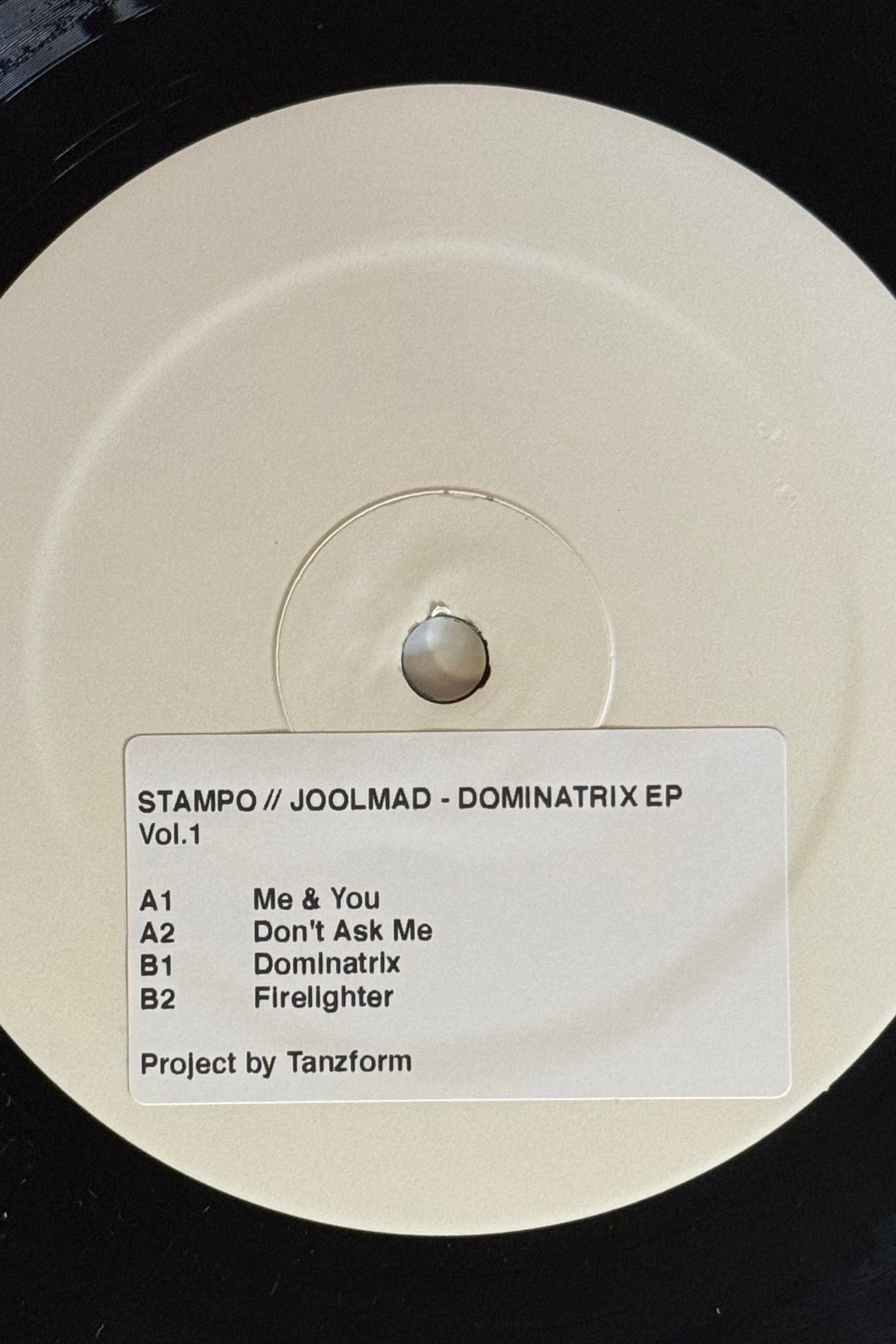 white label record with a sticker with track names saying joolmad