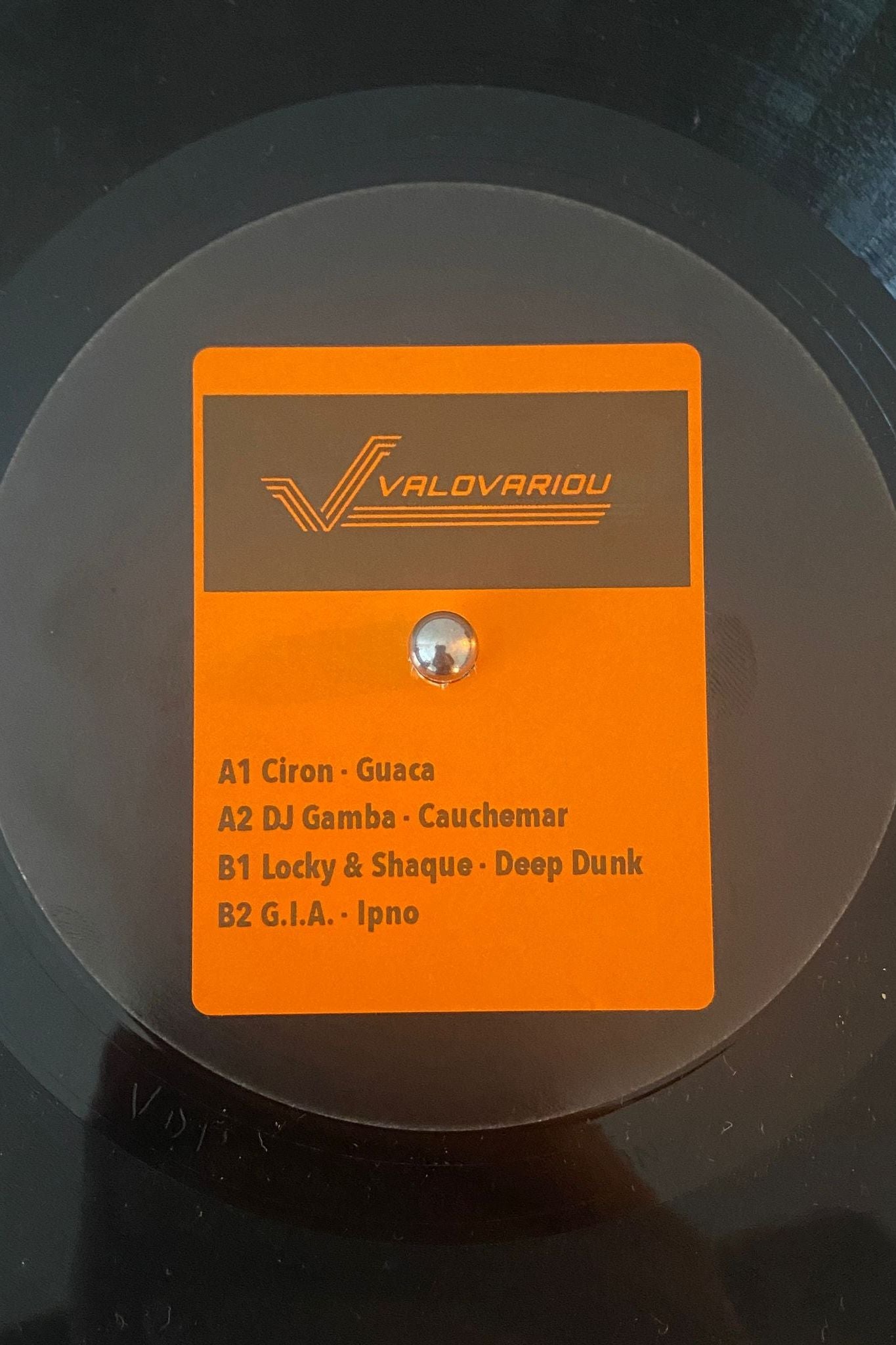 black label vinyl record with an orange sticker saying valovariou