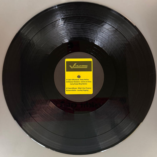 Black vinyl record with yellow artwork and tech-house music on it