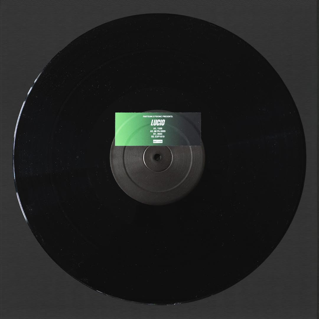 Black vinyl record with a green label on a black background