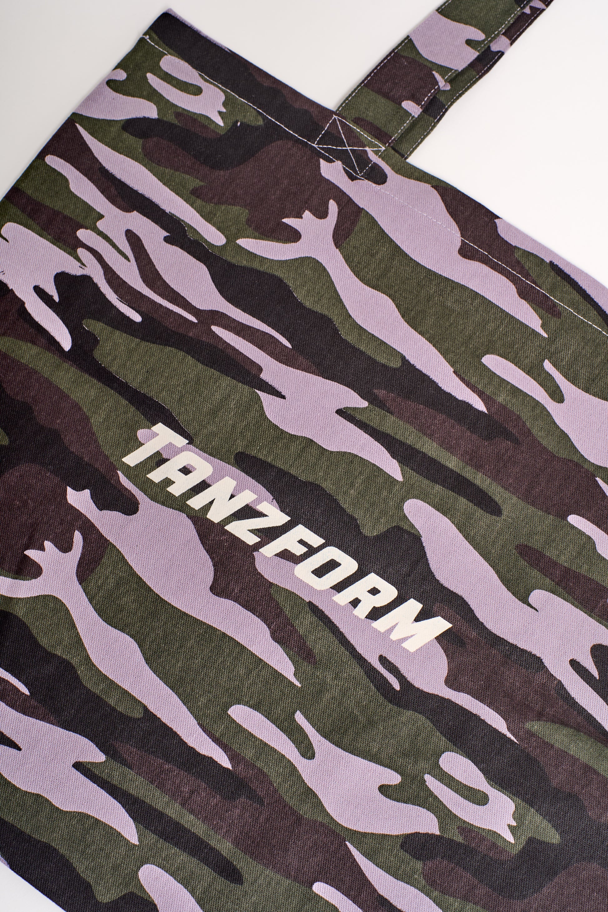 tote bag with camo print and tanzform logo