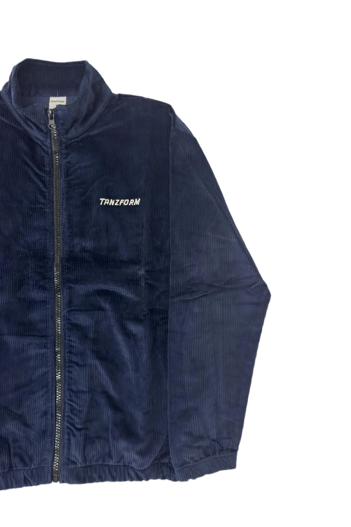 A blue corduroy jacket with a zipper front and the brand name 'Tanzform' visible on the collar.