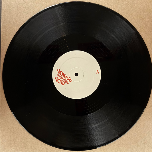 Vinyl record with a red label on a beige background