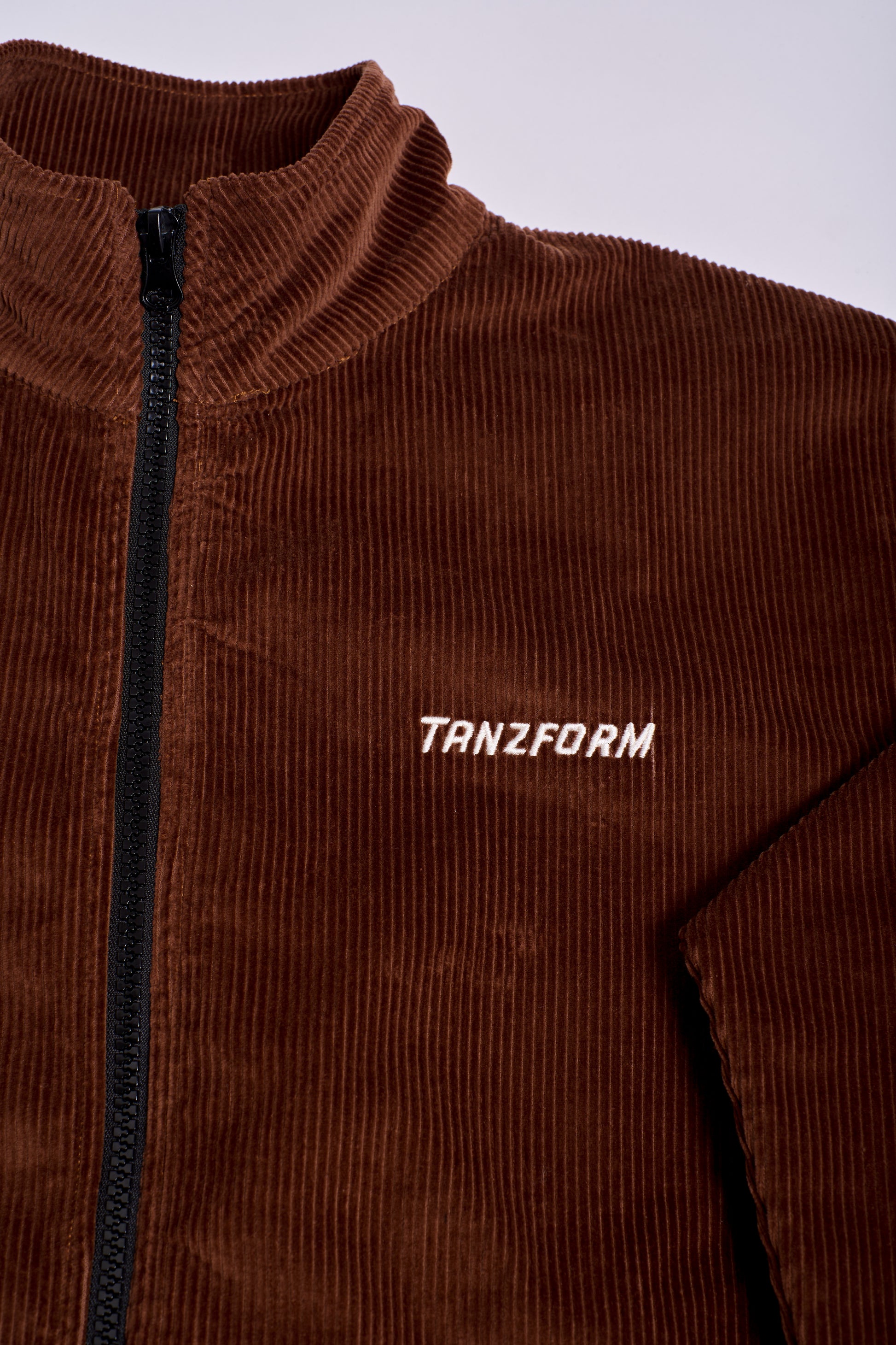 brown corduroy jacket with brand logo