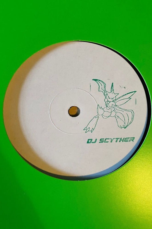 Green vinyl record with a stamp on it of a pokemon called scyther 