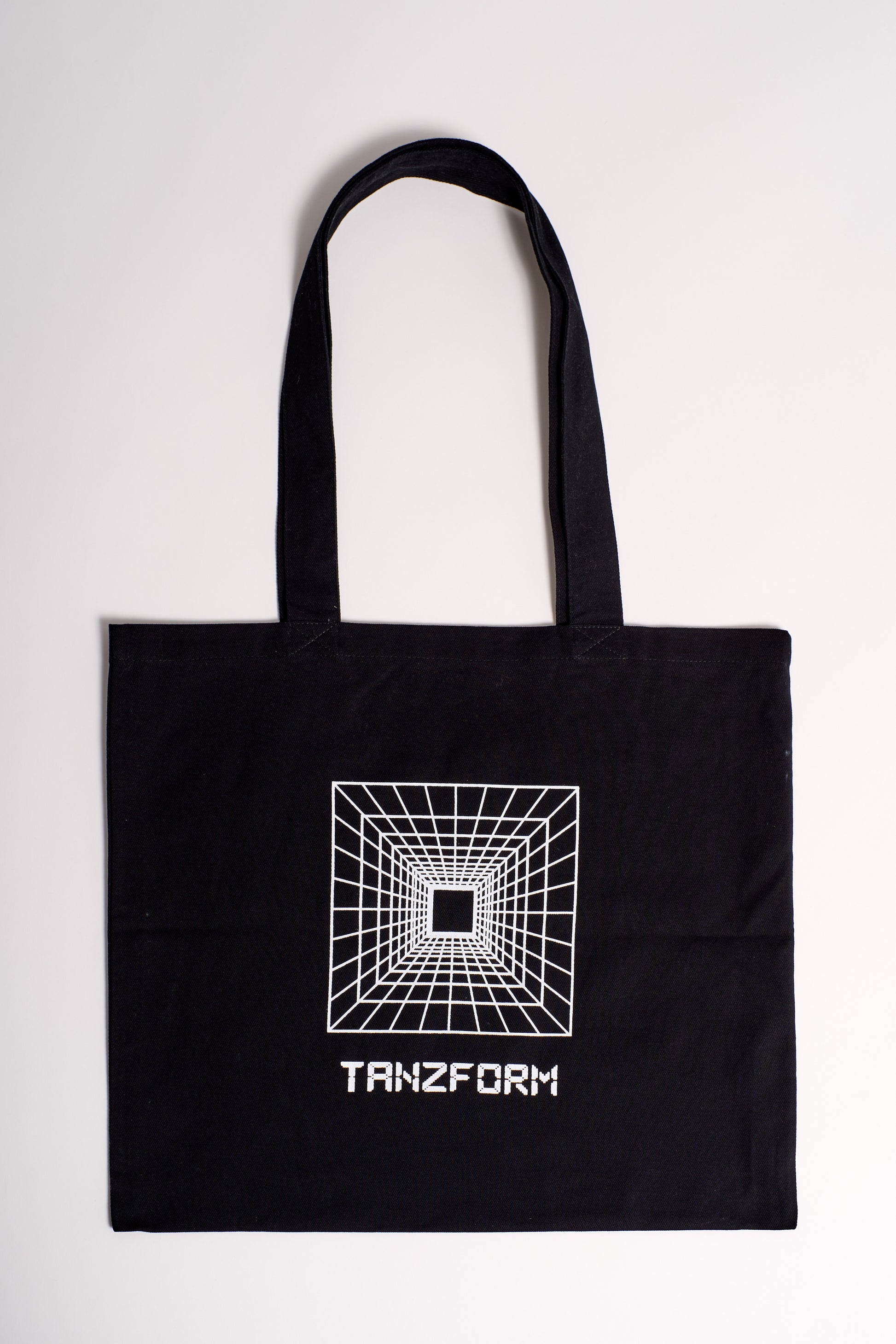 product shot of black tote bag with tanzform logo